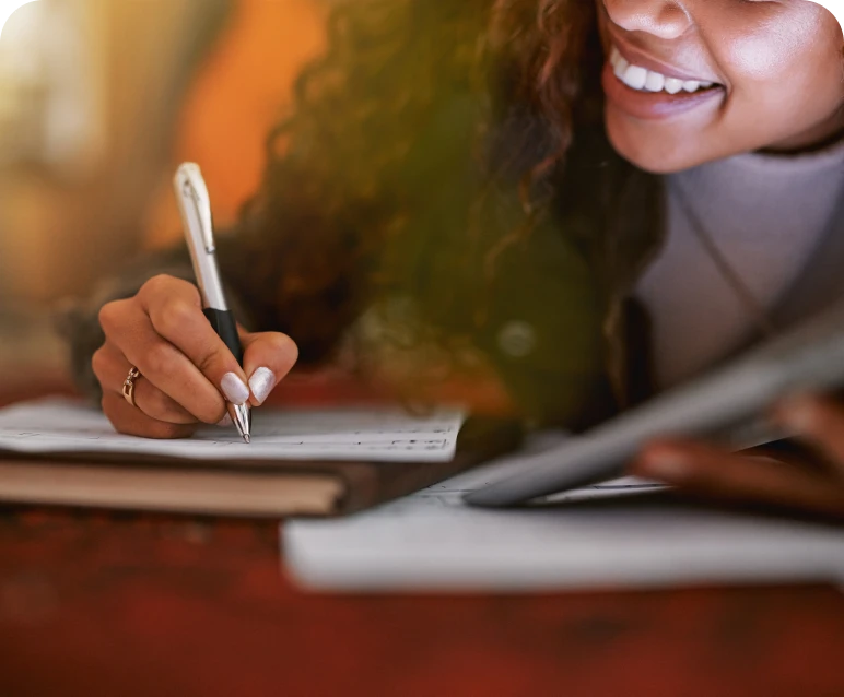 Woman writing notes with a pen